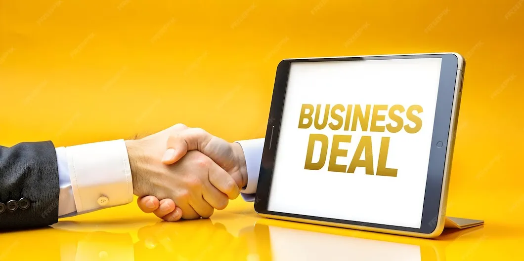 Business handshake symbolizing professional buy and sell business advisory and deal execution.