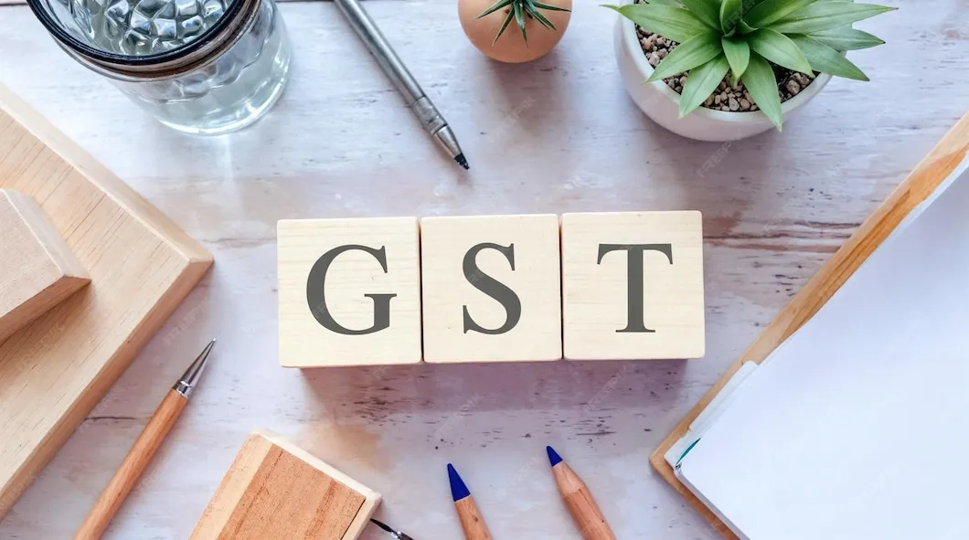 GST blocks displayed on a desk representing goods and services tax compliance. more professional